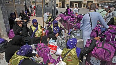 Syrian pilgrims sit with their suitcases at the Bab al-Hawa border crossing with Turkey, from where they will be travelling to Saudi Arabia for the annual Hajj pilgrimage. AFP