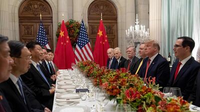 US President Donald Trump (2-R) US Secretary of the Treasury Steven Mnuchin (R) and members of their delegation have dinner with China's President Xi Jinping (3-L) and Chinese government representatives, at the end of the G20 Leaders' Summit in Buenos Aires, on December 01, 2018. US President Donald Trump and his Chinese counterpart Xi Jinping had the future of their trade dispute -- and broader rivalry between the world's two top economies -- on the menu at a high-stakes dinner Saturday. / AFP / SAUL LOEB