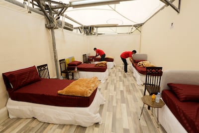 Workers set up accommodation for pilgrims at a tent camp in Mina. AP
