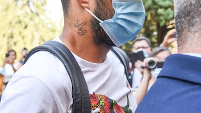 Suarez leaves Perugia's University in Perugia, Italy. EPA