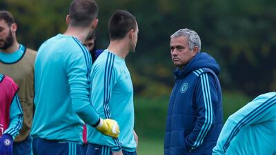 Chelsea manager Jose Mourinho talks to John Terry during a Chelsea training session, ahead of the UEFA Champions League Group G match between Chelsea and Dynamo Kiev on November 3, 2015 in Cobham, England. Getty Images