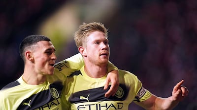Manchester City's Kevin de Bruyne, right, celebrates scoring their side's third goal with Phil Foden against Bristol City at Ashton Gate in Bristol, England, Tuesday, February 28, 2023. PA