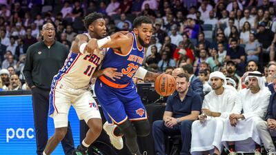 New York Knicks five-time All-Star Karl-Anthony Towns drives the ball against Justin Edwards of the Philadelphia 76ers at the Etihad Arena in Abu Dhabi. All photos: Victor Besa / The National