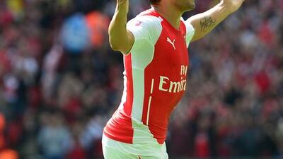 Arsenal midfielder Santi Cazorla celebrates scoring the opening goal during the Community Shield against Manchester City at Wembley Stadium in London on August 10, 2014. Carl Court / AFP