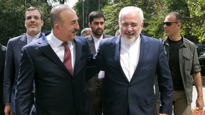 Turkish foreign minister Mevlut Cavusoglu welcomes his Iranian counterpart Mohammad Javad Zarif for a meeting at the Foreign Ministry in Ankara on August 12, 2016. Adem Altan / AFP Photo