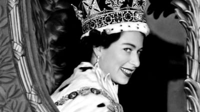 Queen Elizabeth II smiles to the crowd after her coronation in June 1953.