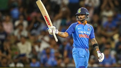 India's Virat Kohli celebrates scoring 50 runs against New Zealand at Bay Oval. AP