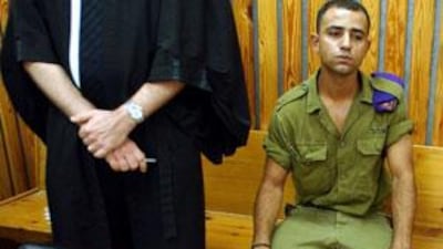 Taysir Hayb, an Israeli Bedouin soldier, sits in a courtroom prior to a session of his trial in the Kastina Military Court in July 2004.