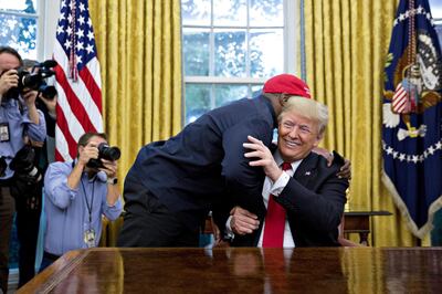 Kanye West hugs U.S. President Donald Trump. Andrew Harrer, Bloomberg
