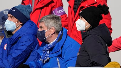 China's Peng Shuai, right, watches the women's freestyle skiing big air finals with Thomas Bach, center, president of the International Olympic Committee. AP