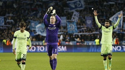 Football Soccer - Dynamo Kiev v Manchester City - UEFA Champions League Round of 16 First Leg - NSC Olimpiyskiy Stadium, Kiev, Ukraine - 24/2/16Manchester City's Joe Hart applauds fans after the game as Gael Clichy and David Silva look onReuters / Gleb GaranichLivepicEDITORIAL USE ONLY.