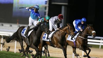 Joao Moreira was ecstatic after giving Vivlos a brilliant run to win the Dubai Turf title at Meydan Racecourse on Saturday night. Pawan Singh / The National