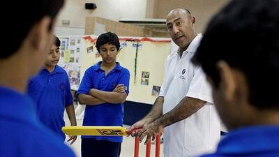 Mudassar Nazar with students from the Al Khaleej school, Dubai, in a file photo. Ana Bianca Marin for The National