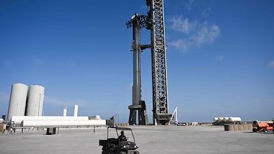 The SpaceX Starship with a booster stands on the launch pad ahead of its flight test from Starbase. AFP