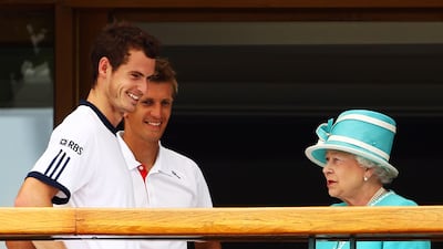 UK tennis player Andy Murray and Jarkko Nieminen of Finland meet the queen at Wimbledon. Getty