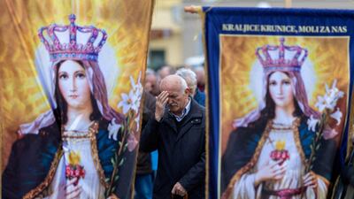 Men pray in Zagreb's main square, Croatia. Reuters