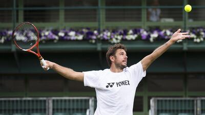 Stan Wawrinka prepares to serve during a practice session on Saturday ahead of the Monday start to the 2015 Wimbledon championship. Peter Klaunzer / EPA / June 27, 2015