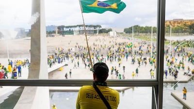 Supporters of Brazil's former president Jair Bolsonaro demonstrate outside Congress in Brasilia. Reuters