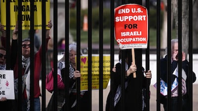 People protest against the Gaza war in a demonstration outside the White House gates. AFP