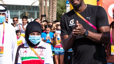 Usain Bolt with Emirati para athlete Hamda Hosani.