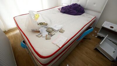 Foreign currency banknotes and various documents are seen in the bedroom of a hideout where the alleged attacker of Reina nightclub was caught by Turkish police, in Esenyurt neighbourhood in Istanbul. Osman Orsal / Reuters