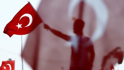A man waves Turkey's national flag during the Democracy and Martyrs Rally, organized by Turkish President Tayyip Erdogan in Istanbul, Turkey. Umit Bektas / Reuters