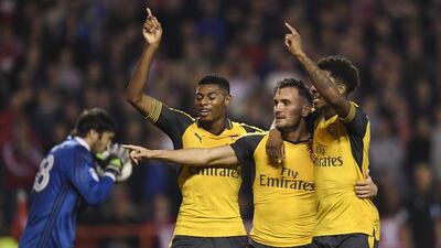 Arsenal’s Lucas Perez celebrates scoring their third goal with Jeff Reine-Adelaide and Chuba Akpom. Tony O’Brien / Action Images / Reuters