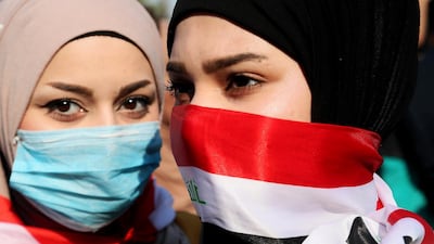 Iraqi women take part in anti-government protests in Tahrir Square, Baghdad. AP