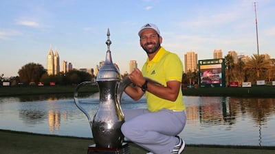 Sergio Garcia poses with the Dallah Trophy after winning the 2017 Omega Dubai Desert Classic. Nezar Balout / EPA