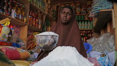 A shopkeeper sells wheat flour in Somalia. The Opec Fund will assist developing countries in covering the import costs of basic commodities amid the Ukraine war. AP