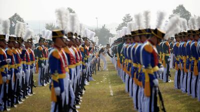 A cadet adjusts his colleague's uniform during a photo opportunity ahead of a celebration to mark the 69th anniversary of Korea Armed Forces Day, in Pyeongtaek, South Korea. Kim Hong-Ji / Reuters