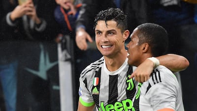 Juventus' Cristiano Ronaldo (L) celebrates after scoring during the Italian Serie A soccer match between Juventus FC and Genoa CFC at Allianz stadium in Turin, Italy, 30 October 2019. EPA