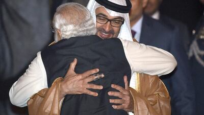 Indian Prime Minister Narendra Modi greets Crown Prince of Abu Dhabi, Sheikh Mohammed bin Zayed, after the prince arrived at an air force base in New Delhi. Prakash Singh / AFP Photo