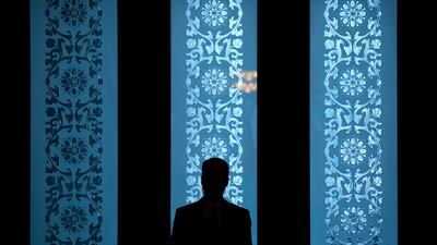A security official stands guard in the Great Hall of the People during group discussion meetings for delegates held on the sidelines of China's 19th Party Congress in Beijing. Mark Schiefelbein / AP Photo