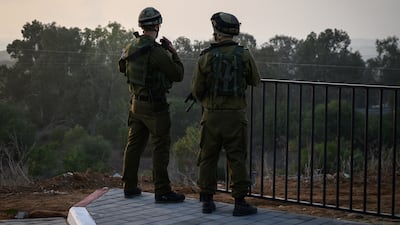 Israeli soldiers look out towards Gaza – but whether they are sizing up a full-scale ground incursion remains to be seen. Getty Images