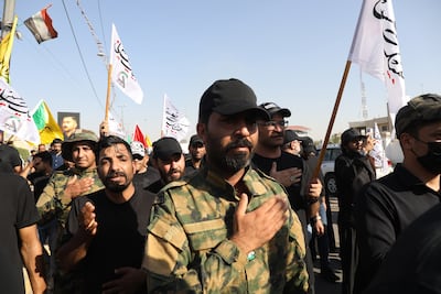 PMF members mourn during a funeral of their colleague, who was killed in an air strike in southern Baghdad last year. EPA