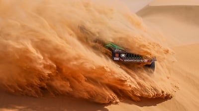 epa08920280 A handout photo made available by ASO of Alabdalali Saleh and Mohammed Alnaim of Saudi Arabia, Hummer, Saleh, in action during the 3rd stage of the Dakar 2021 with start and finish in Wadi Al Dawasir, in Saudi Arabia. EPA