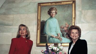Former first lady Hillary Rodham Clinton poses with former first lady Betty Ford under Ms Ford's White House portrait in Washington. AP
