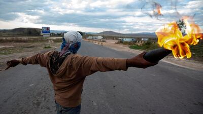 Opponents of Venezuelan President Nicolas Maduro clash with members of the National Guard on the border between Brazil and Venezuela. EPA