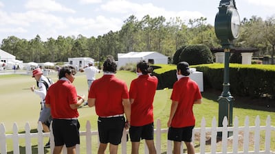 Credential-holding members/spectators wear red tops and black pants as a tribute to Tiger Woods as they watch during the final round of the World Golf Championships - Workday Championship at The Concession golf tournament in Bradenton. EPA