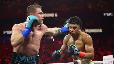 Canelo Alvarez lands a left on Jaime Munguia. AFP