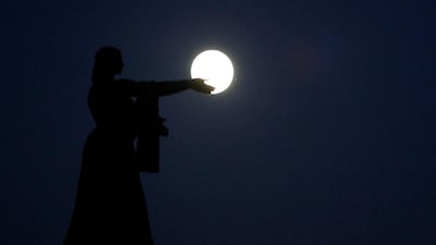 The supermoon rises over La Raza monument, in Ciudad Juarez, Mexico, on November 13, 2016. Jose Luis Gonzalez / Reuters