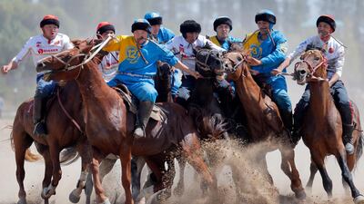 Kazakh and Russian horsemen take part in the traditional Central Asian sport of kok-boru (goat dragging). EPA