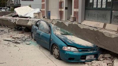 A car is crushed by a beam in central Christchurch, New Zealand.