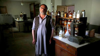 Posing for the photo is Khuda Daad, the head of the laboratory at the Jabal Saraj factory.