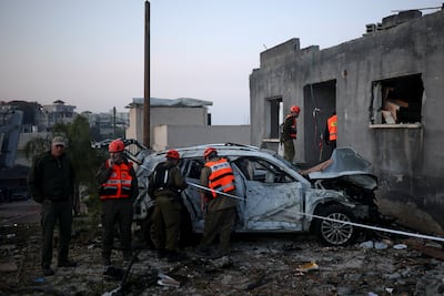 Israeli emergency personnel work at the site of an Iranian missile strike in the north of the country. Reuters