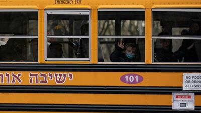 A boy looks out the window of a school bus in the Brooklyn borough of New York City. Reuters