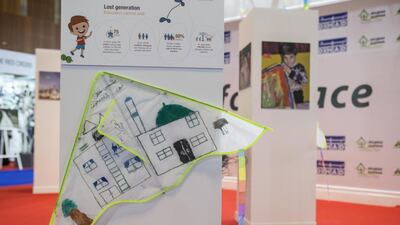 Fly for Peace kites featuring Syrian refugee children’s artwork were displayed at Dihad in Dubai. Antonie Robertson / The National