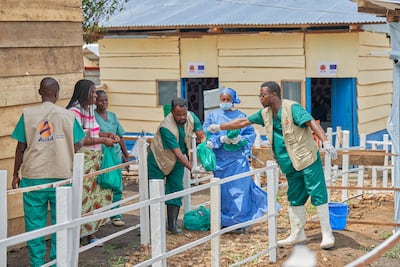 Medical staff present certificates of recovery from Ebola to former patients discharged from hospital in DR Congo. EPA