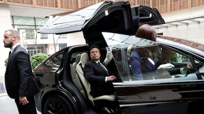 Billionaire Elon Musk gets in a Tesla car as he leaves a hotel in Beijing, China, on May 31, 2023. Reuters